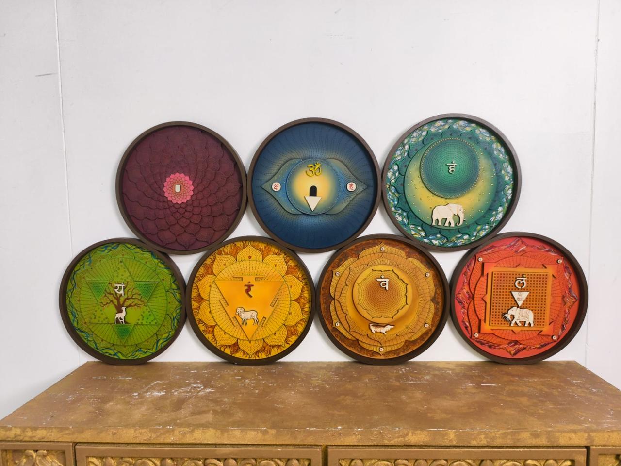 Round carved chakra panels in deep blue and saffron