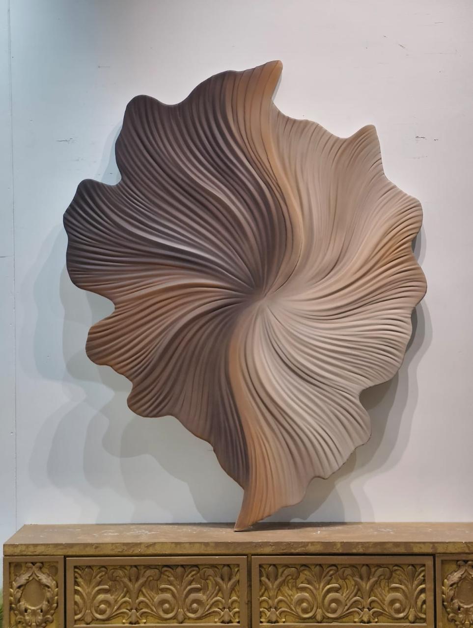 Abstract carved swirl in layered brown and beige ridges